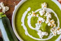 Creamy Zucchini Soup Topped with Crunchy Popcorn Garnish