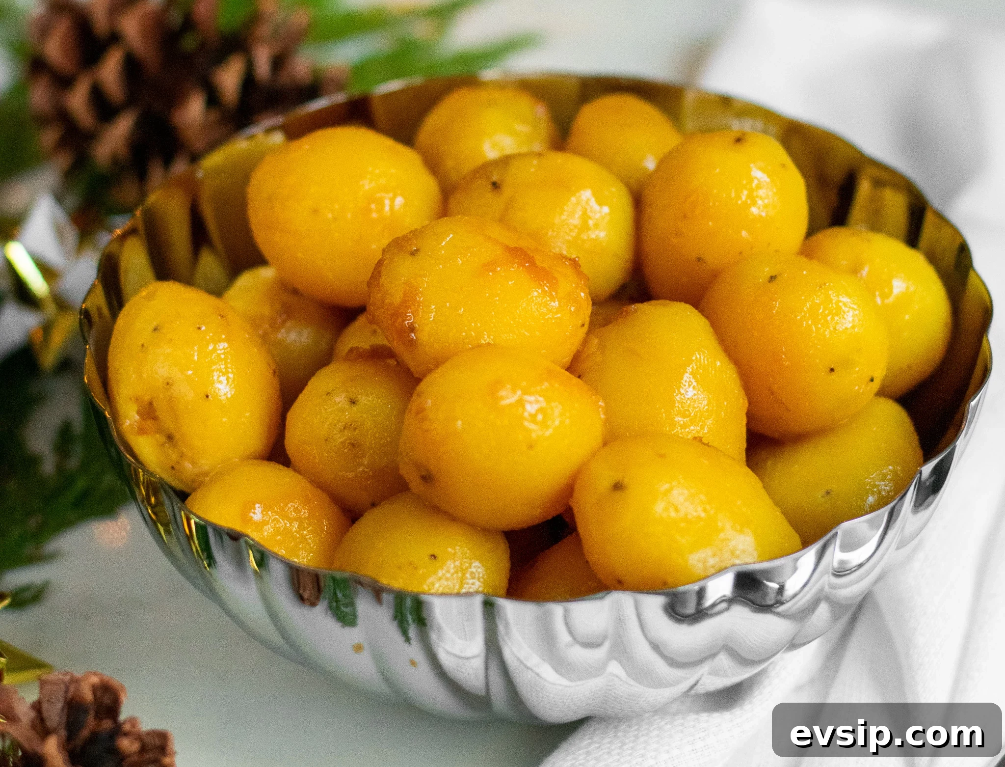 A bowl of caramelized potatoes.