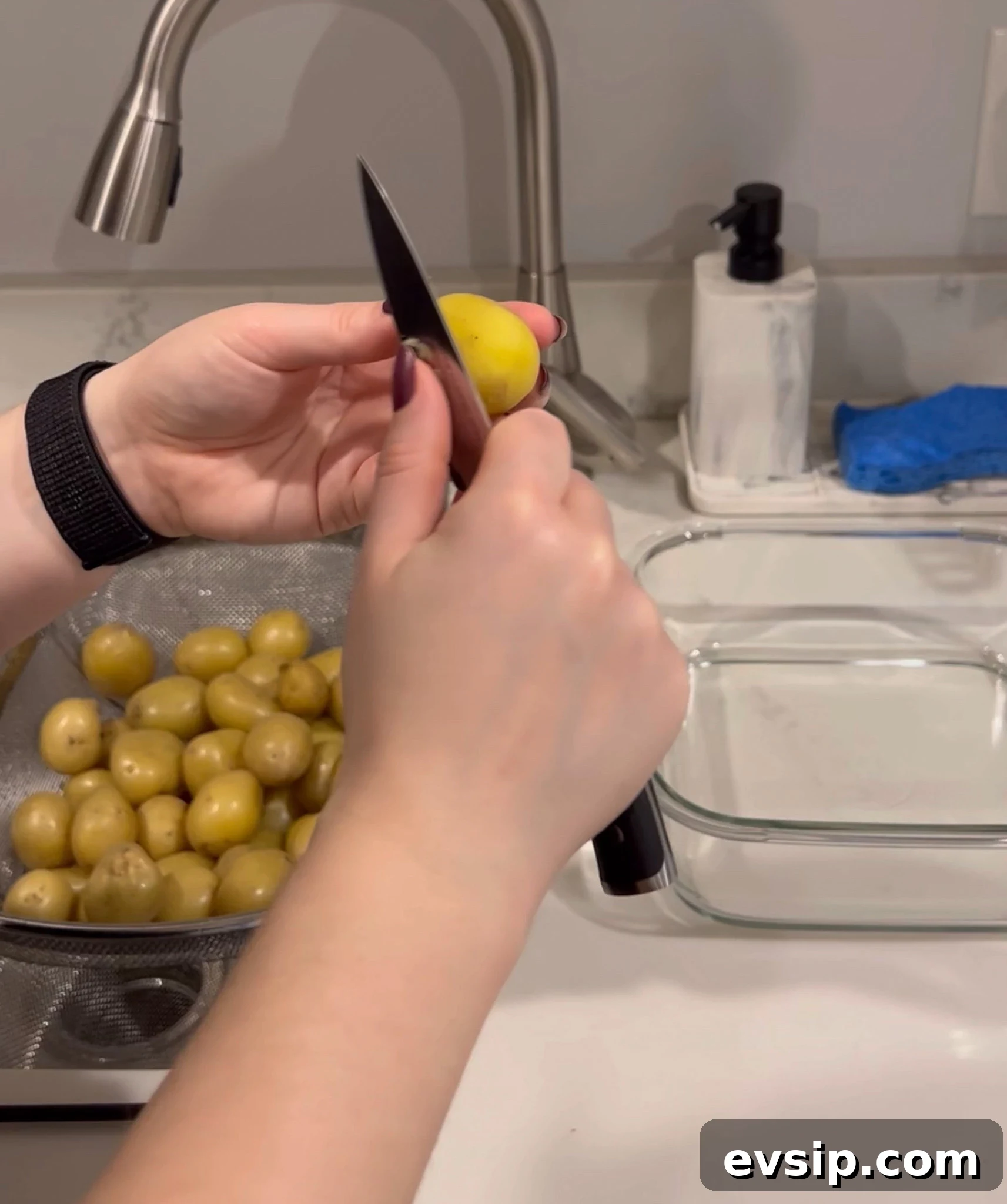 Peeling potatoes with a paring knife.