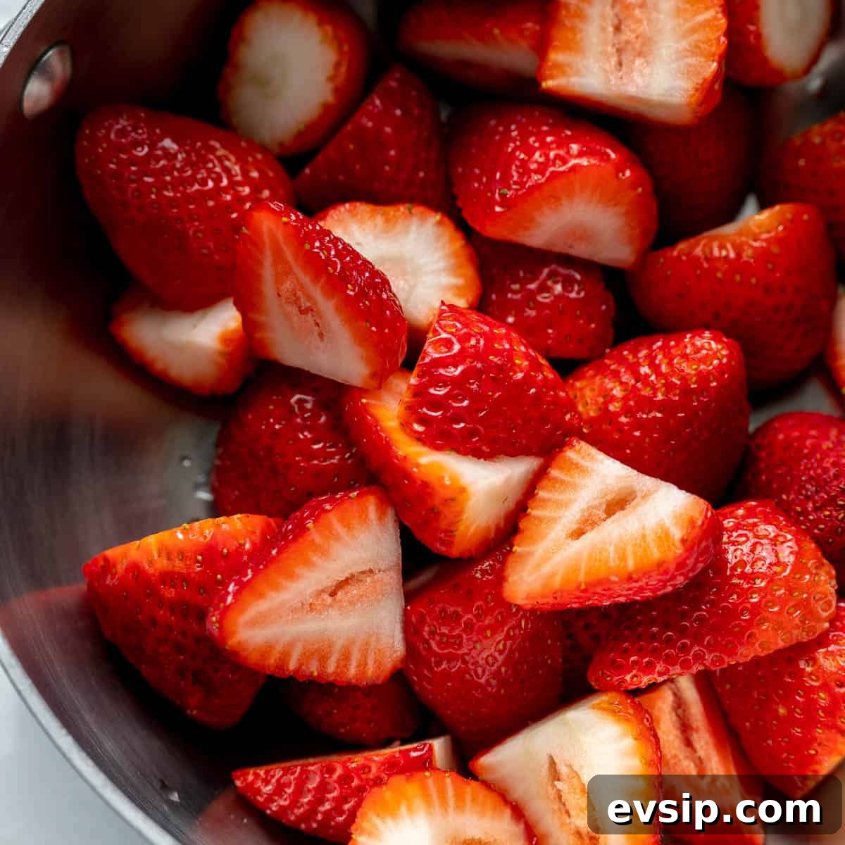 Homemade Strawberry Compote: Quick Recipe for Desserts 4 A close up of halved strawberries in a pot