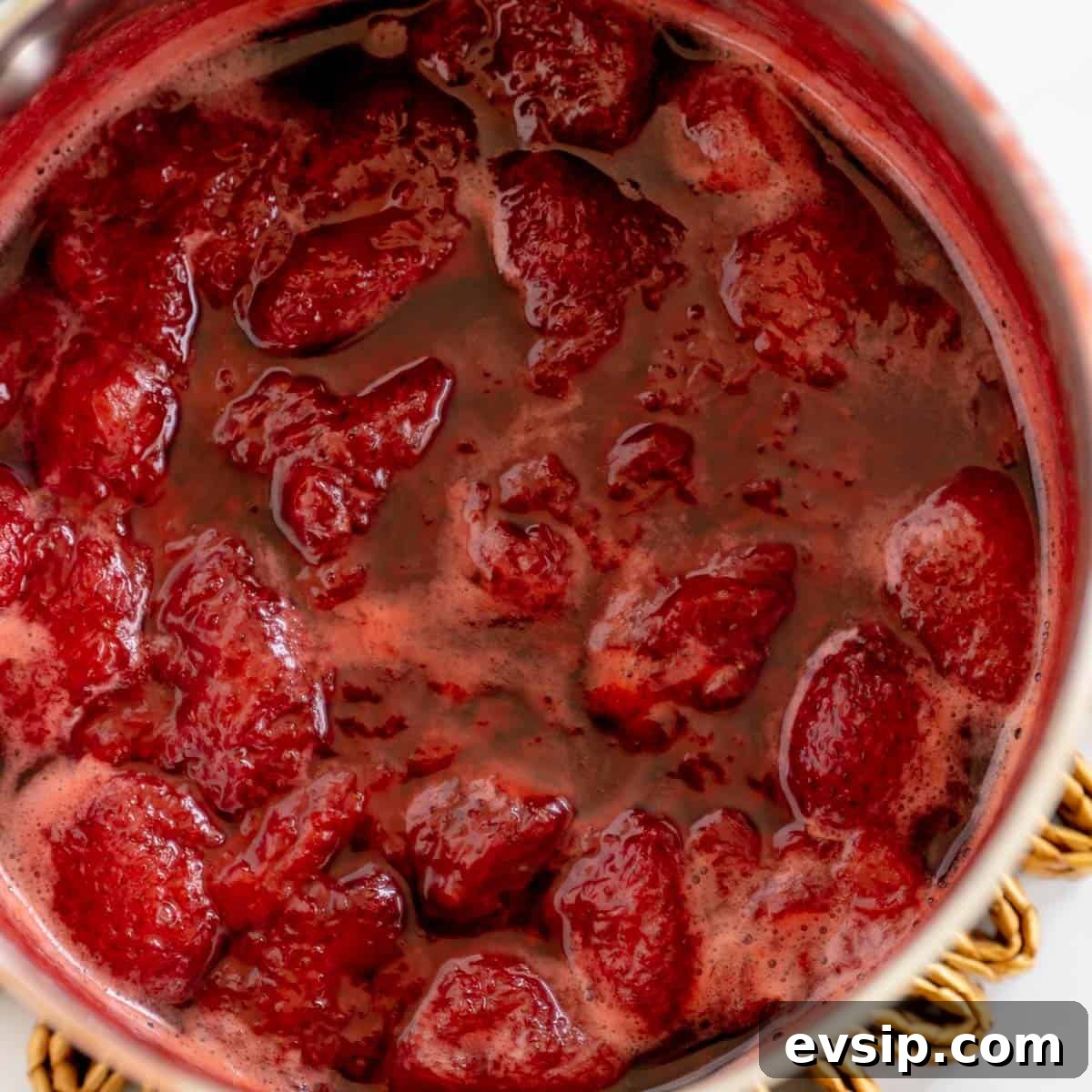 Homemade Strawberry Compote: Quick Recipe for Desserts 7 Chunky strawberries simmering in a pot