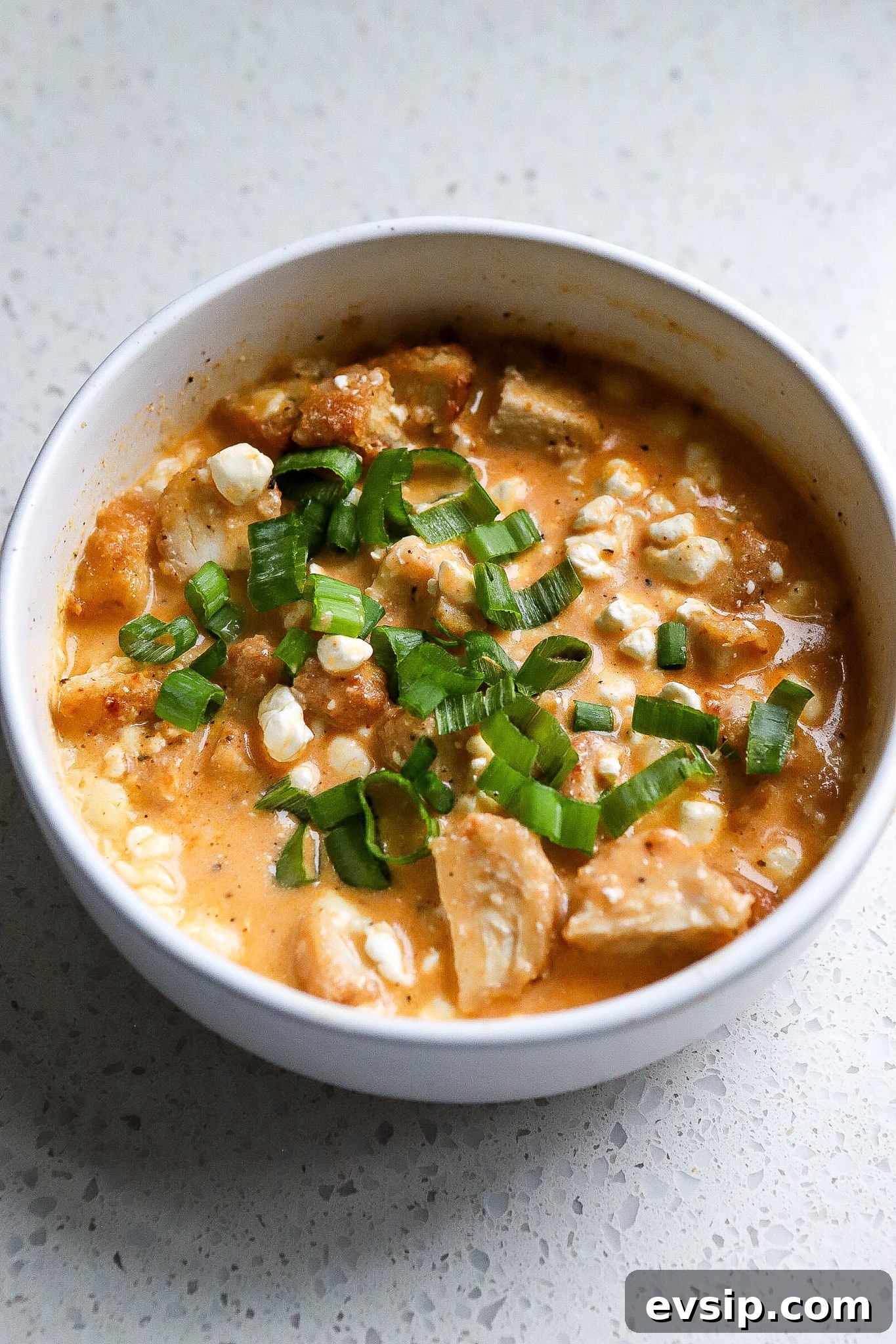 Buffalo Chicken Cottage Cheese Bowl for High-Protein Meals 6 Side angle of a cottage cheese buffalo chicken bowl.