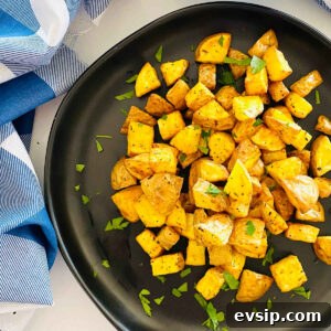 Crispy Air Fryer Diced Potatoes You’ll Love 7 air fryer diced potatoes on a plate with parsley garnish