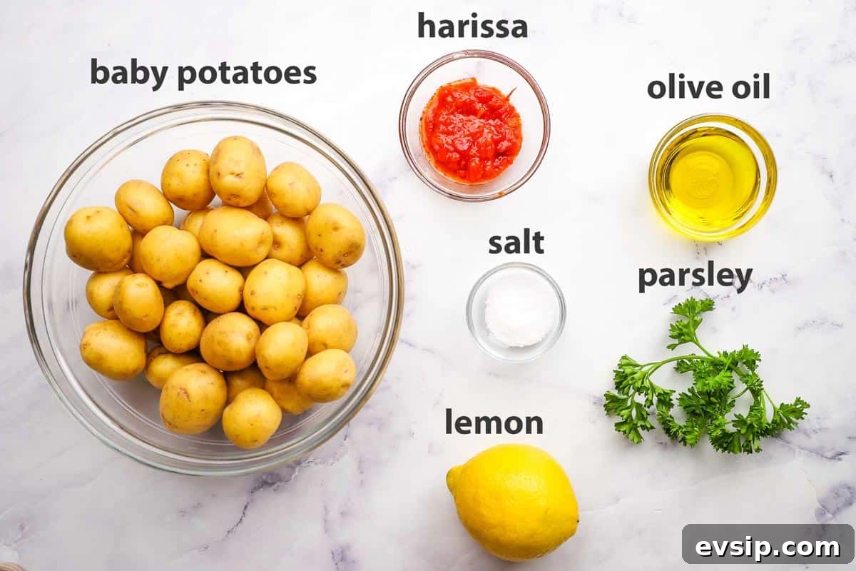 ingredients pictured and labelled for harissa potatoes