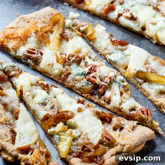 Caramelized Onion and Cheese Flatbreads for Entertaining 2 Cheesy Caramelized Onion Flatbreads with pears, blue cheese, and pecans.