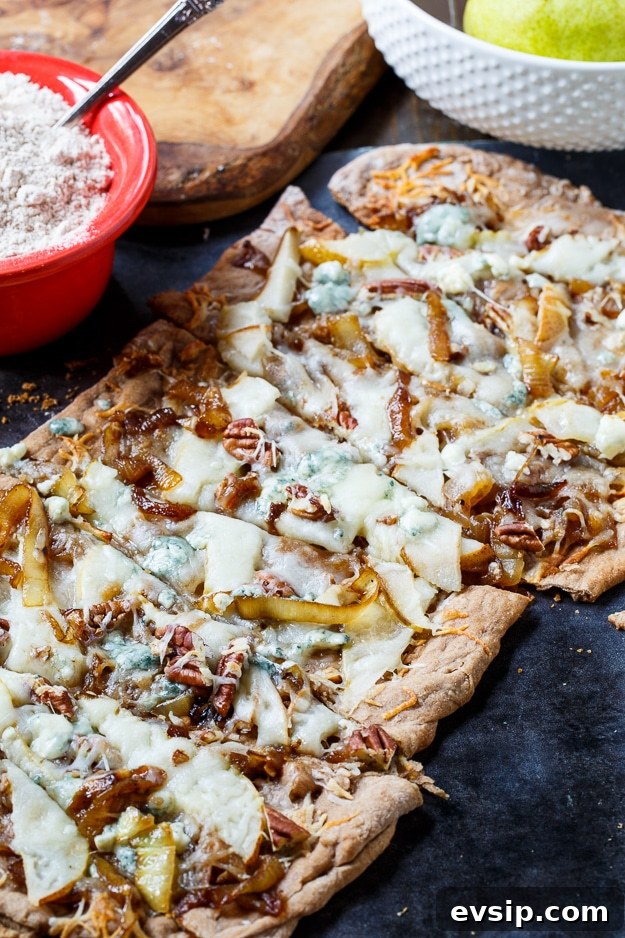 Caramelized Onion and Cheese Flatbreads for Entertaining 3 Cheesy Caramelized Onion Flatbread with pears, blue cheese, and pecans.