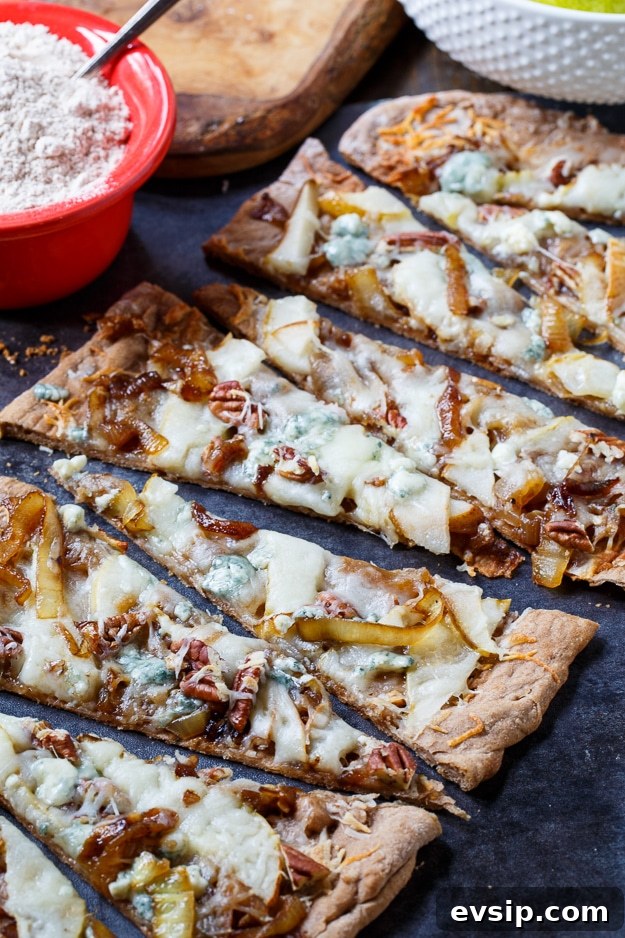 Caramelized Onion and Cheese Flatbreads for Entertaining 4 Cheesy Caramelized Onion Flatbreads with pears, blue cheese, and pecans.
