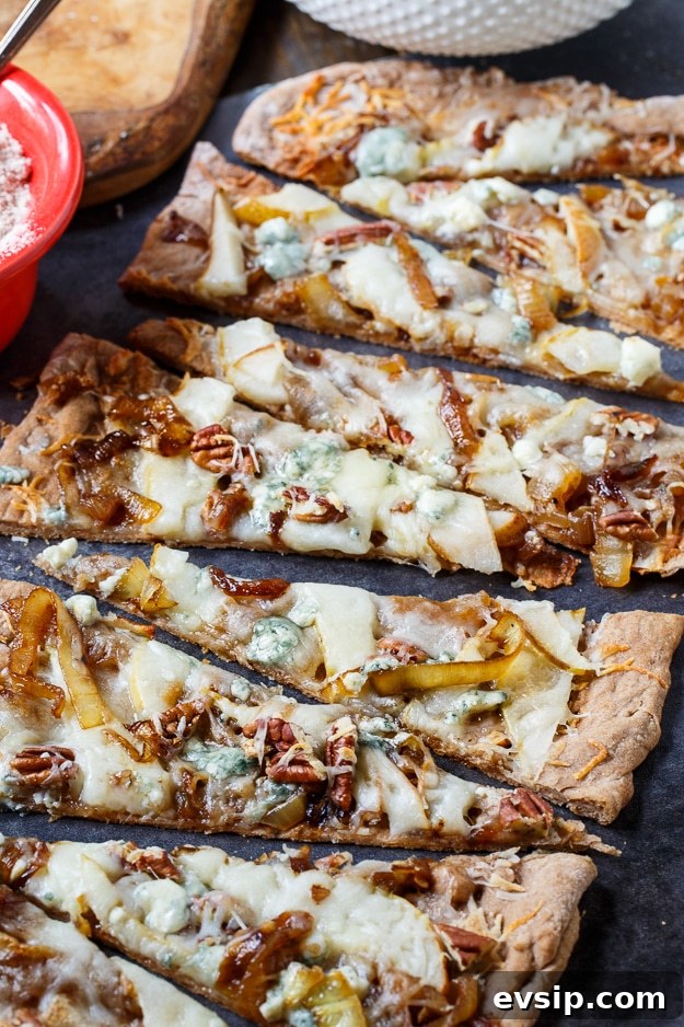 Caramelized Onion and Cheese Flatbreads for Entertaining 6 Cheesy Caramelized Onion Flatbread with pears, blue cheese, and pecans.