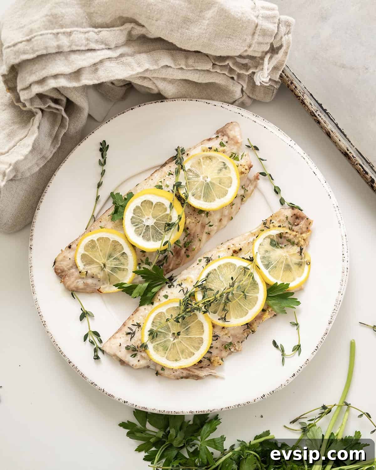 Crispy Baked Red Snapper with Lemon and Herbs 2 Baked red snapper topped with lemon and thyme.