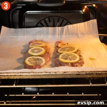Crispy Baked Red Snapper with Lemon and Herbs 7 Red snapper on a baking tray in the oven.