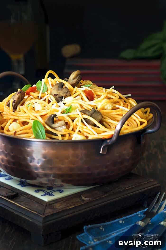 Caramelized Cauliflower & Mushroom Spaghetti Recipe for Dinner 3 A bowl of food on a table, with Spaghetti and Pasta