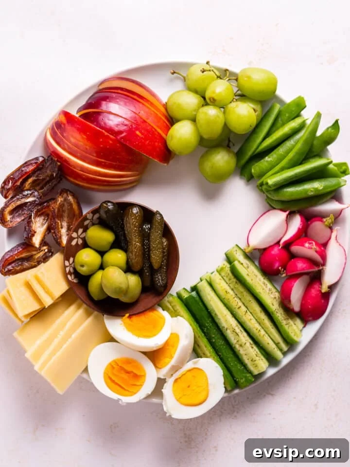 olives and cornichons added to snack plate