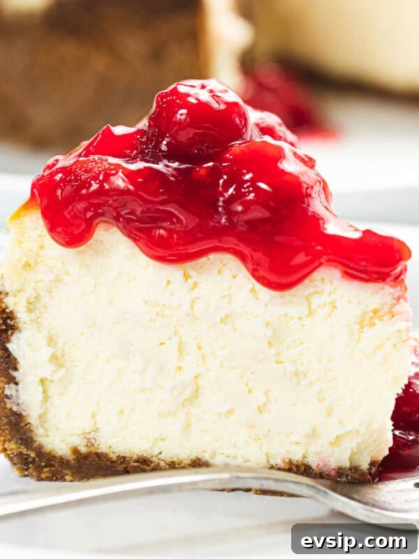 Silky Raspberry Cheesecake Recipe with Fresh Berry Glaze 13 Cherry cheesecake with graham cracker crust.