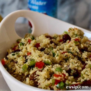 a big bowl filled with a colorful quinoa salad