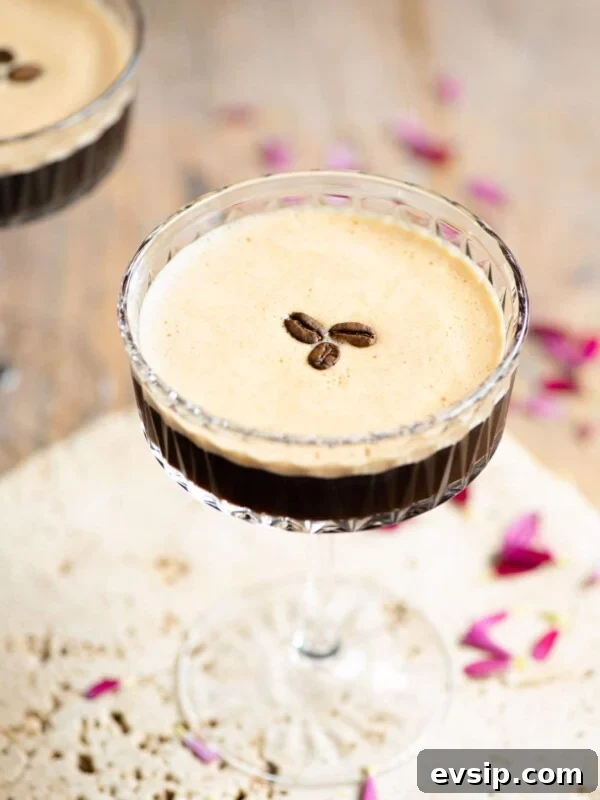 An espresso martini with 3 coffee beans on top