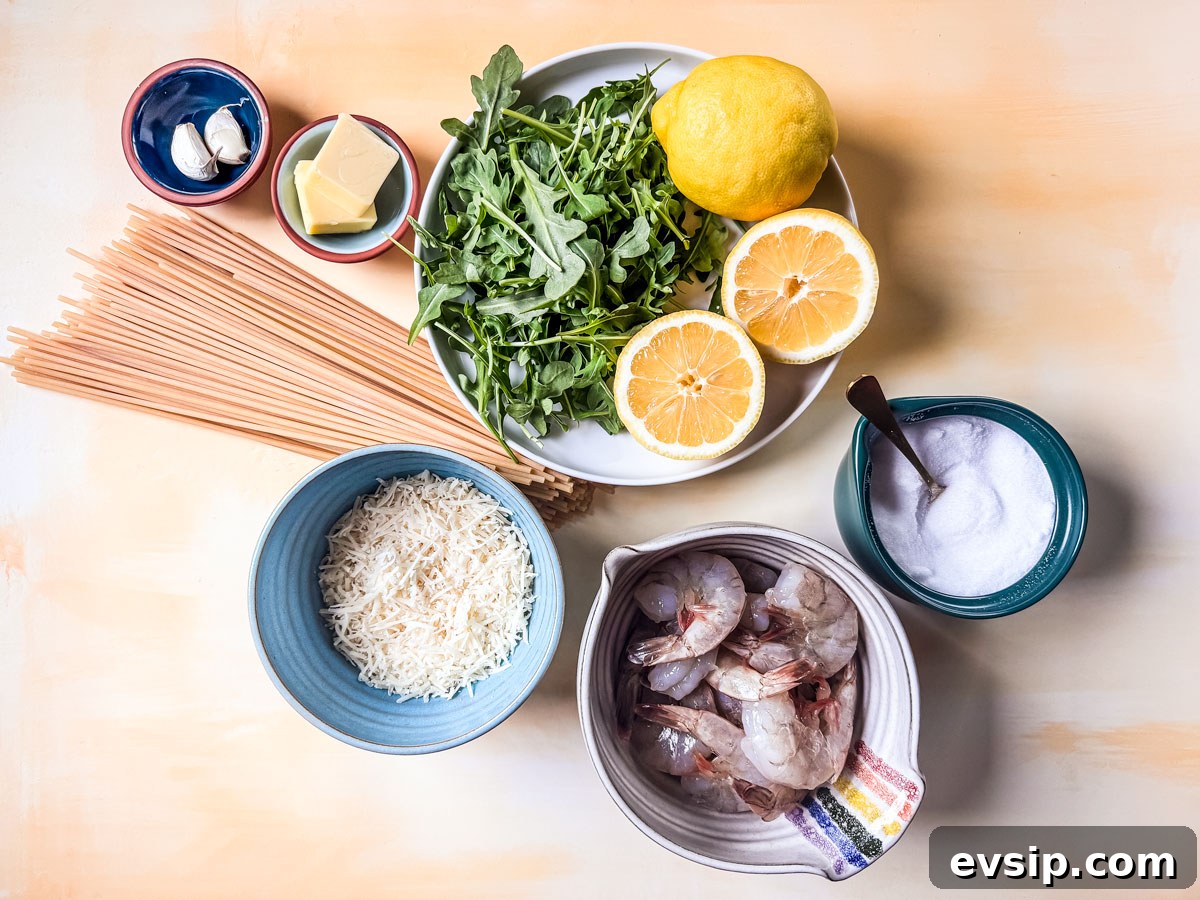 Lemon Shrimp Pasta al Limone — Creamy Citrus Pasta Recipe 3 Ingredients for lemon pasta with shrimp laid out on a yellow background.