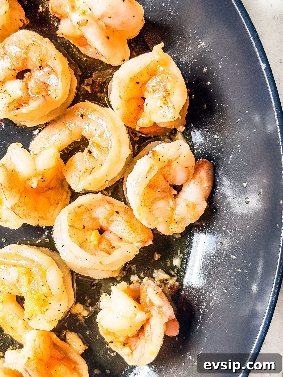 Lemon Shrimp Pasta al Limone — Creamy Citrus Pasta Recipe 4 Cooked shrimp in a pan.