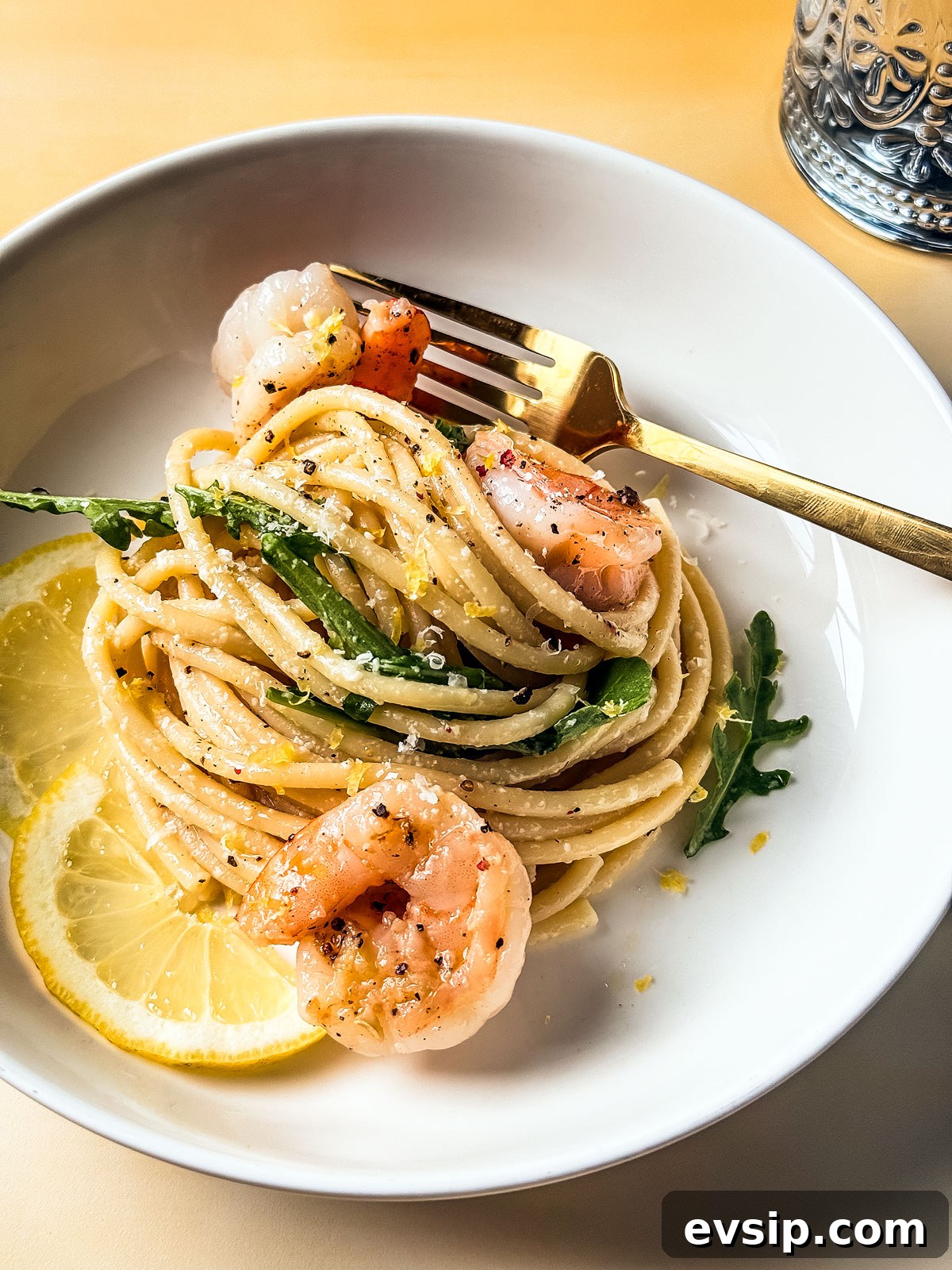 Lemon Shrimp Pasta al Limone — Creamy Citrus Pasta Recipe 6 Pasta al limone in a bowl with arugula and shrimp.