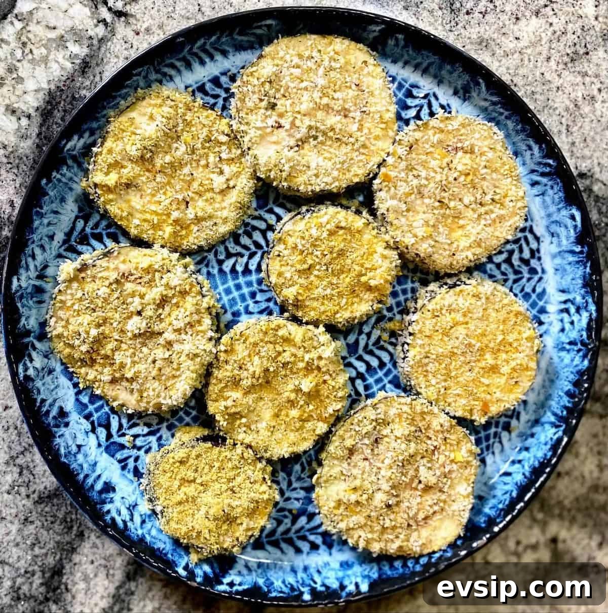 Air-fried slices of eggplant on a plate on the counter