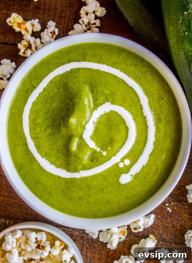 Creamy Zucchini Soup Topped with Crunchy Popcorn Garnish 10 creamy zucchini soup with a drizzle of cream, popcorn.
