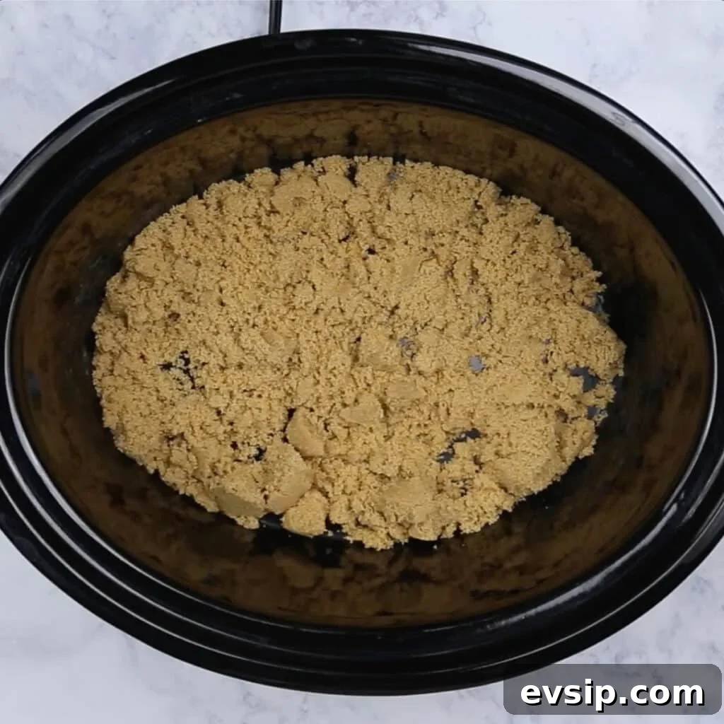 Brown sugar in the bottom of a crockpot.