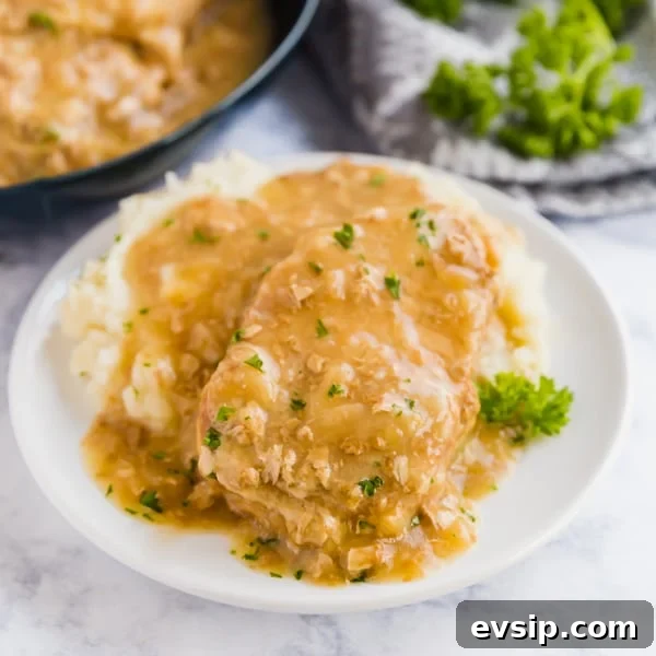 Say goodbye to dry and tough pork chops: these Smothered Crock Pot Pork Chops are the ultimate fall-apart tender comfort food. With just 4 ingredients, this easy dinner will be your new go-to dump dinner!