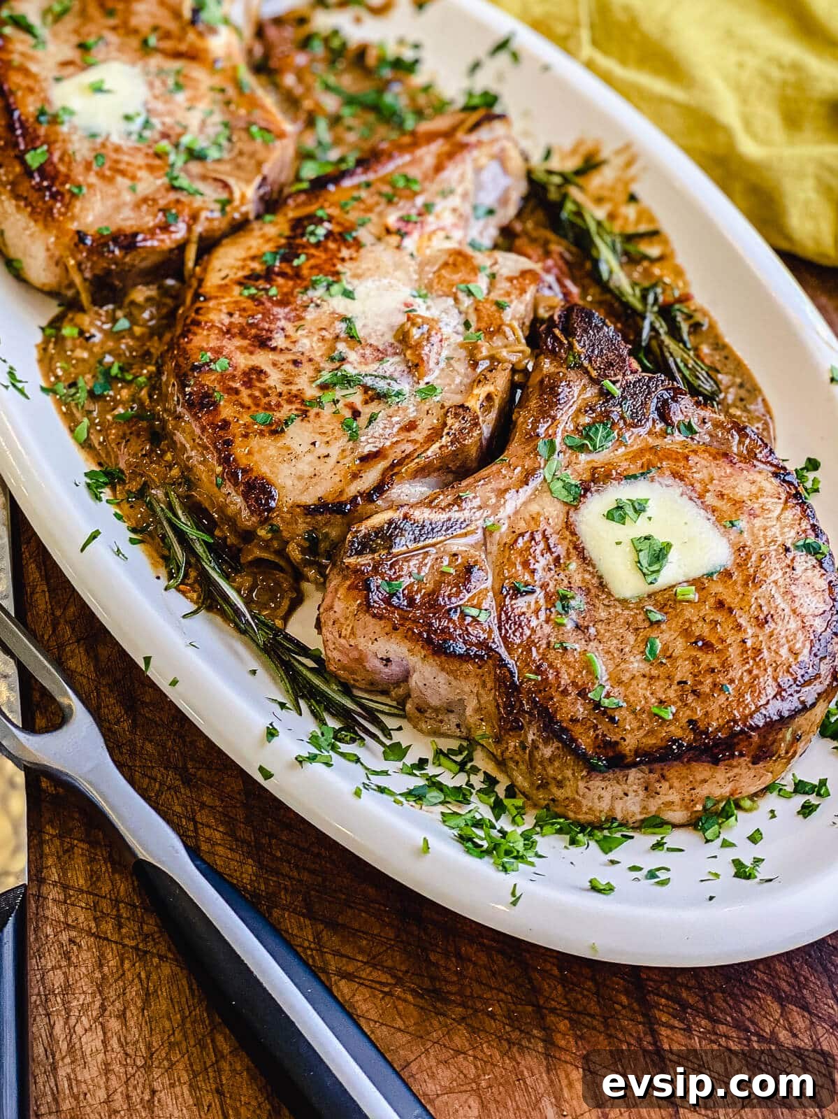 Pan-Seared Pork Chops with Rustic Sun-Dried Tomato Sauce 9 platter of pan seared pork chops