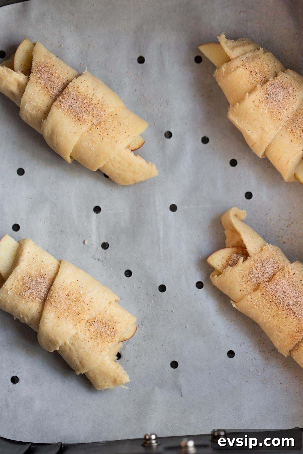 Uncooked apple pie crescent rolls in air fryer