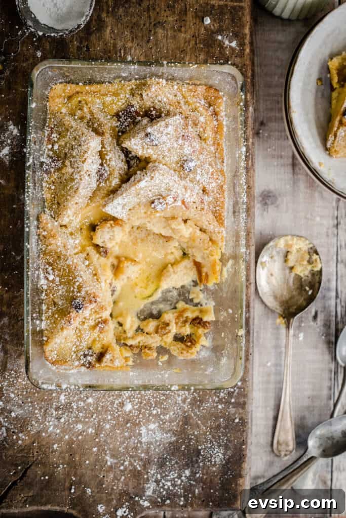Gluten-Free Bread and Butter Pudding Recipe — Cozy Dessert Guide 12 bread and butter pudding in a serving dish with a portion removed