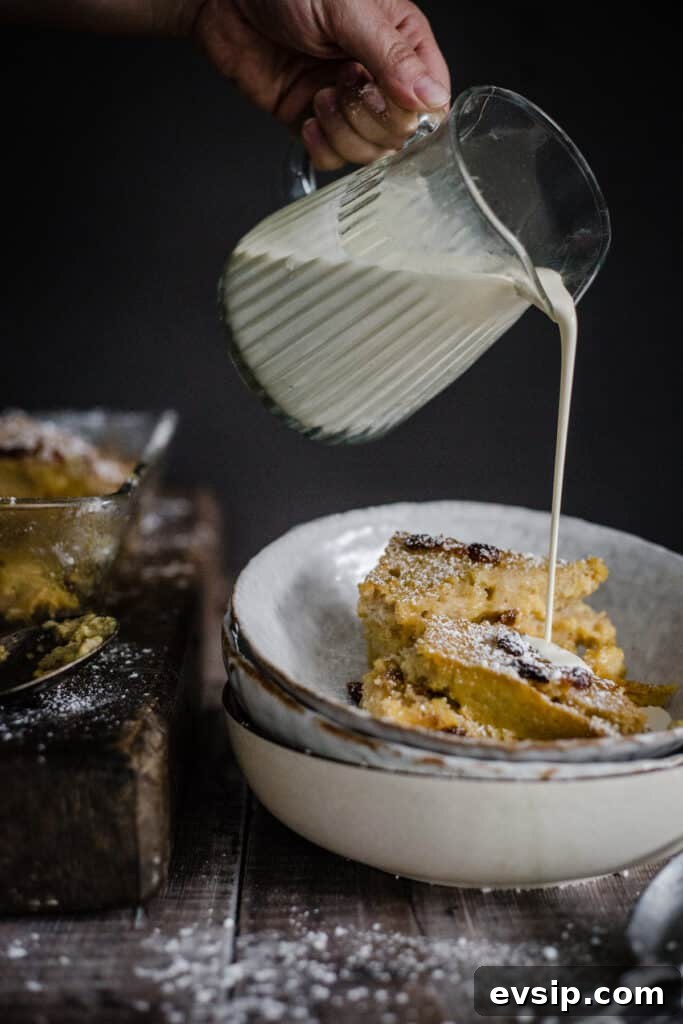 Gluten-Free Bread and Butter Pudding Recipe — Cozy Dessert Guide 4 cream being poured into bowl of bread and butter pudding