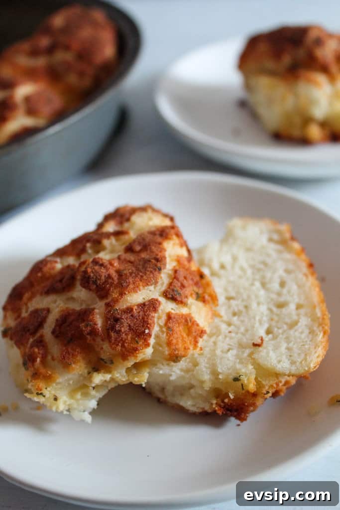 Gluten-Free Dairy-Free Parmesan Pull-Apart Rolls 2 sliced in half gluten free parmesan rolls.