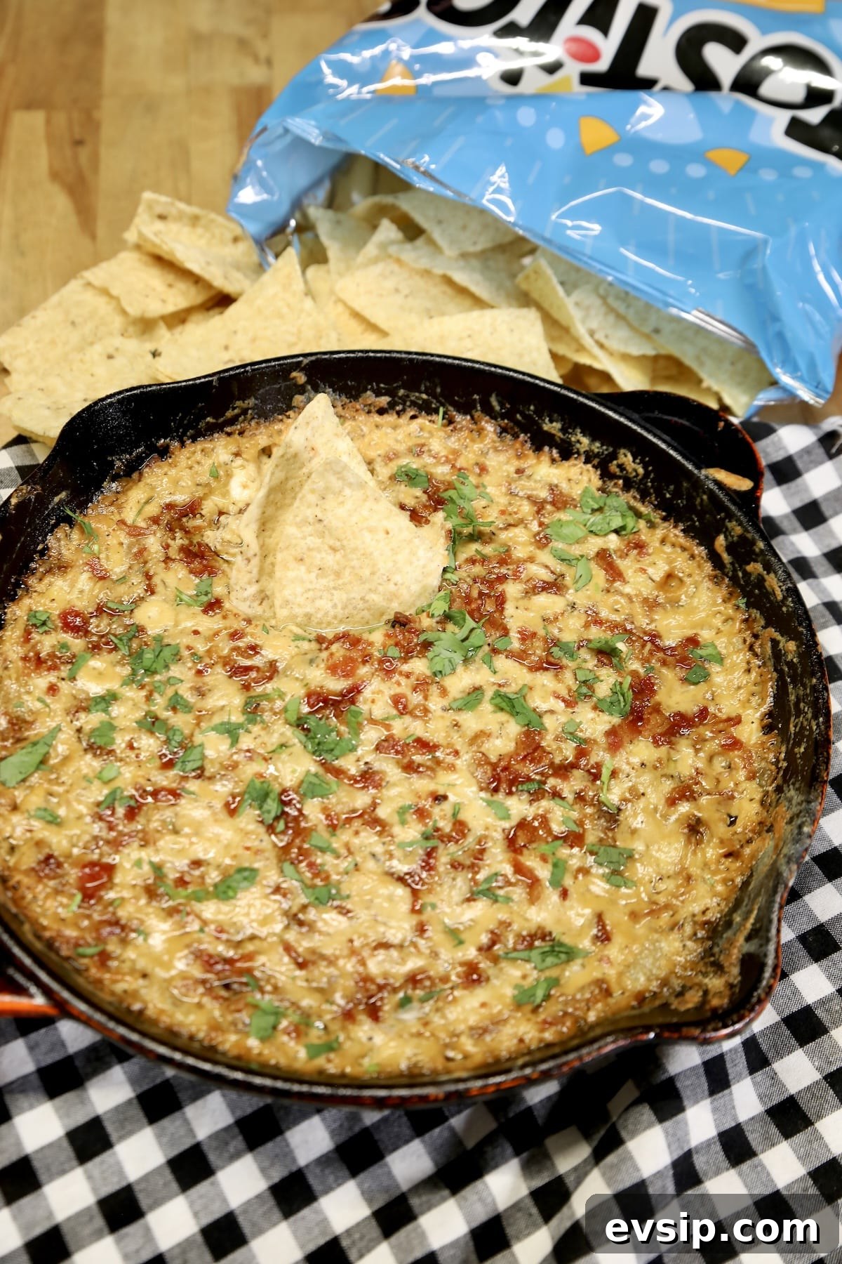 Pellet Grill Smoked Caramelized Onion Dip. Skillet of onion dip with tortilla chips.