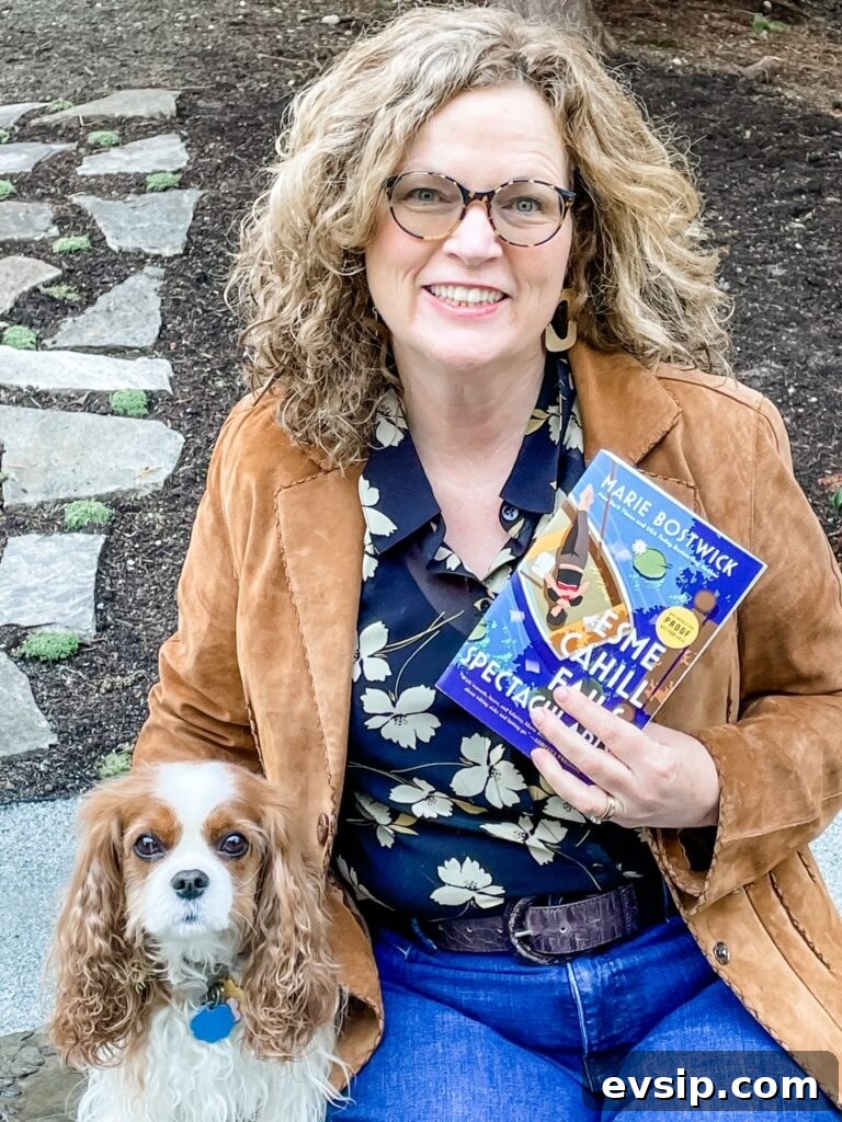 Marie posing with a copy of Esme Cahill