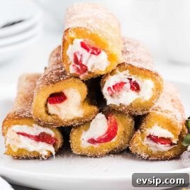 Cinnamon French Toast Roll-Ups with Maple Dipping Sauce 19 close up shot of French Toast Roll-Ups rolled in cinnamon sugar piled on a plate