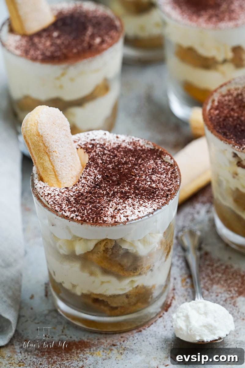 Individual Egg-Free Tiramisu Cups: Creamy No-Bake Dessert 2 tirimisu desserts in individual cups on a serving tray
