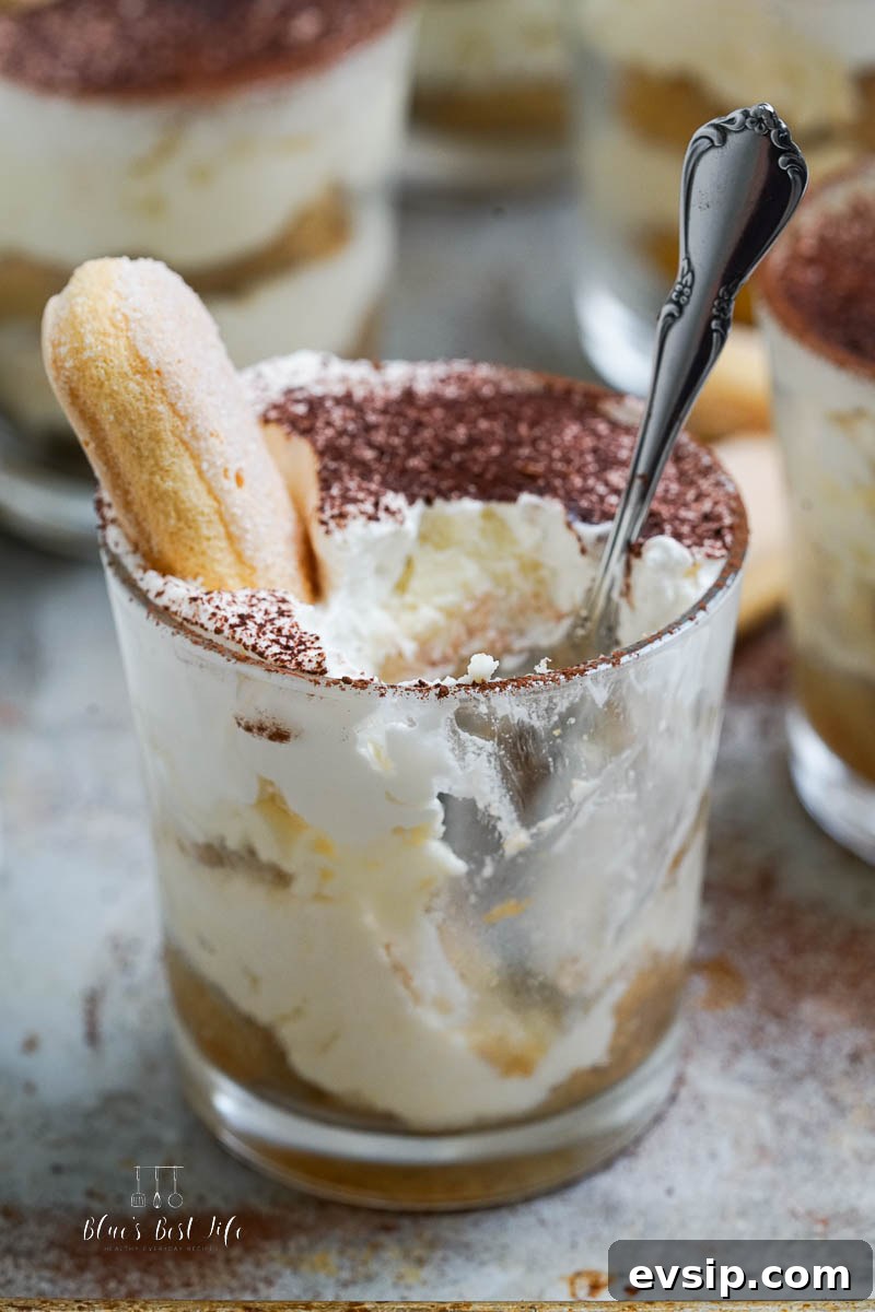 Individual Egg-Free Tiramisu Cups: Creamy No-Bake Dessert 10 tiramisu cup with a bite taken