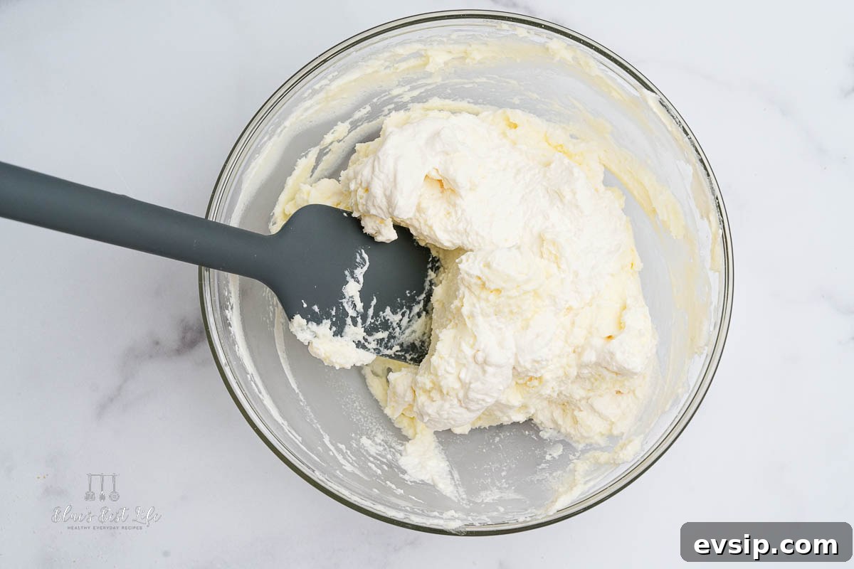 Individual Egg-Free Tiramisu Cups: Creamy No-Bake Dessert 6 folding in whipped cream and mascarpone