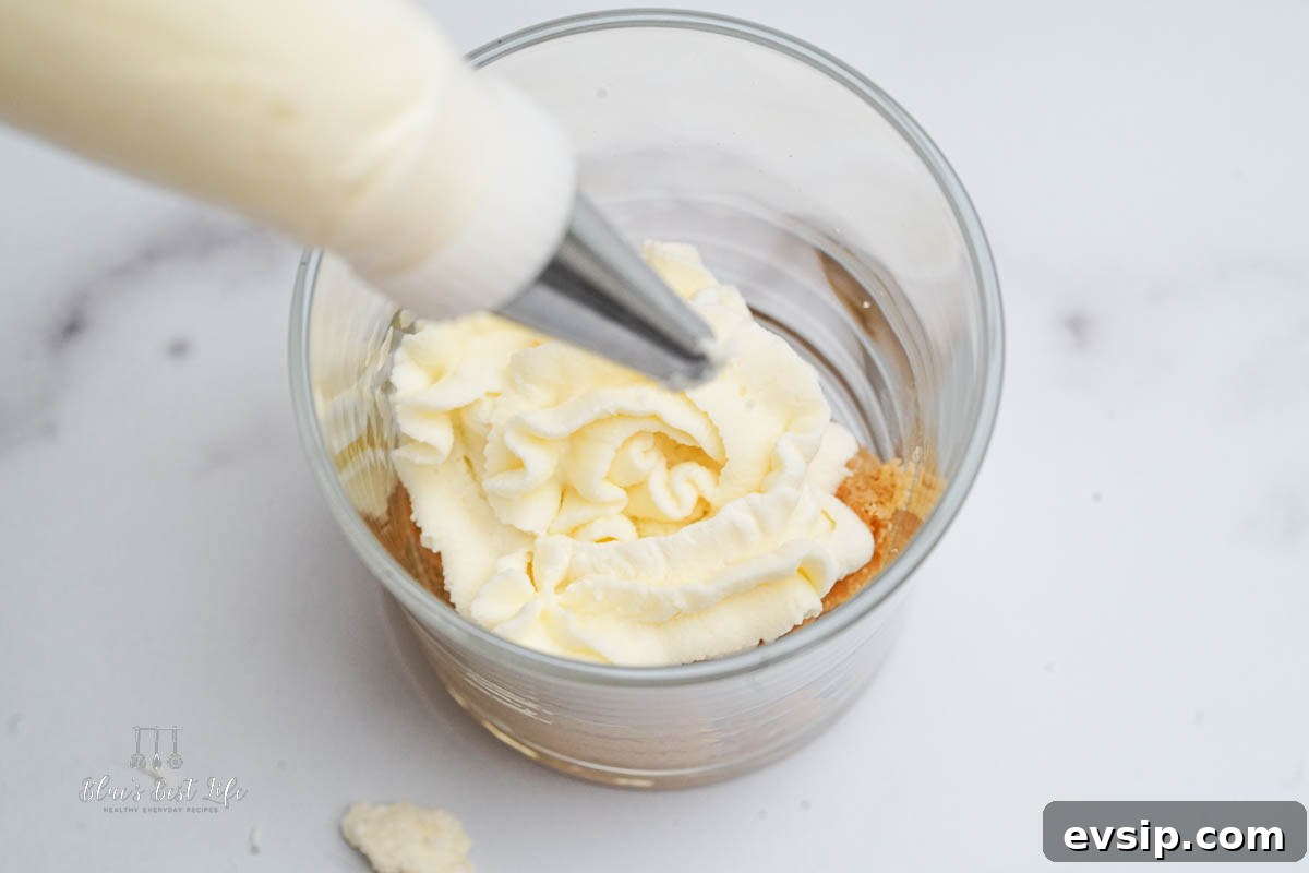 Individual Egg-Free Tiramisu Cups: Creamy No-Bake Dessert 8 piping the mascarpone in layers