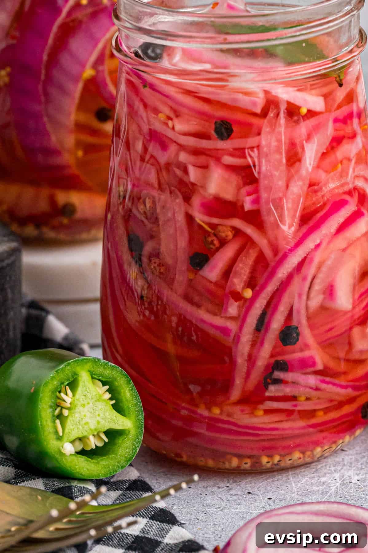 Close up of a jar of pickled red onions
