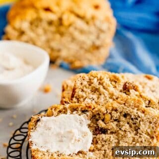 Betty White's Banana Bread with cinnamon cream cheese spread on round rack.
