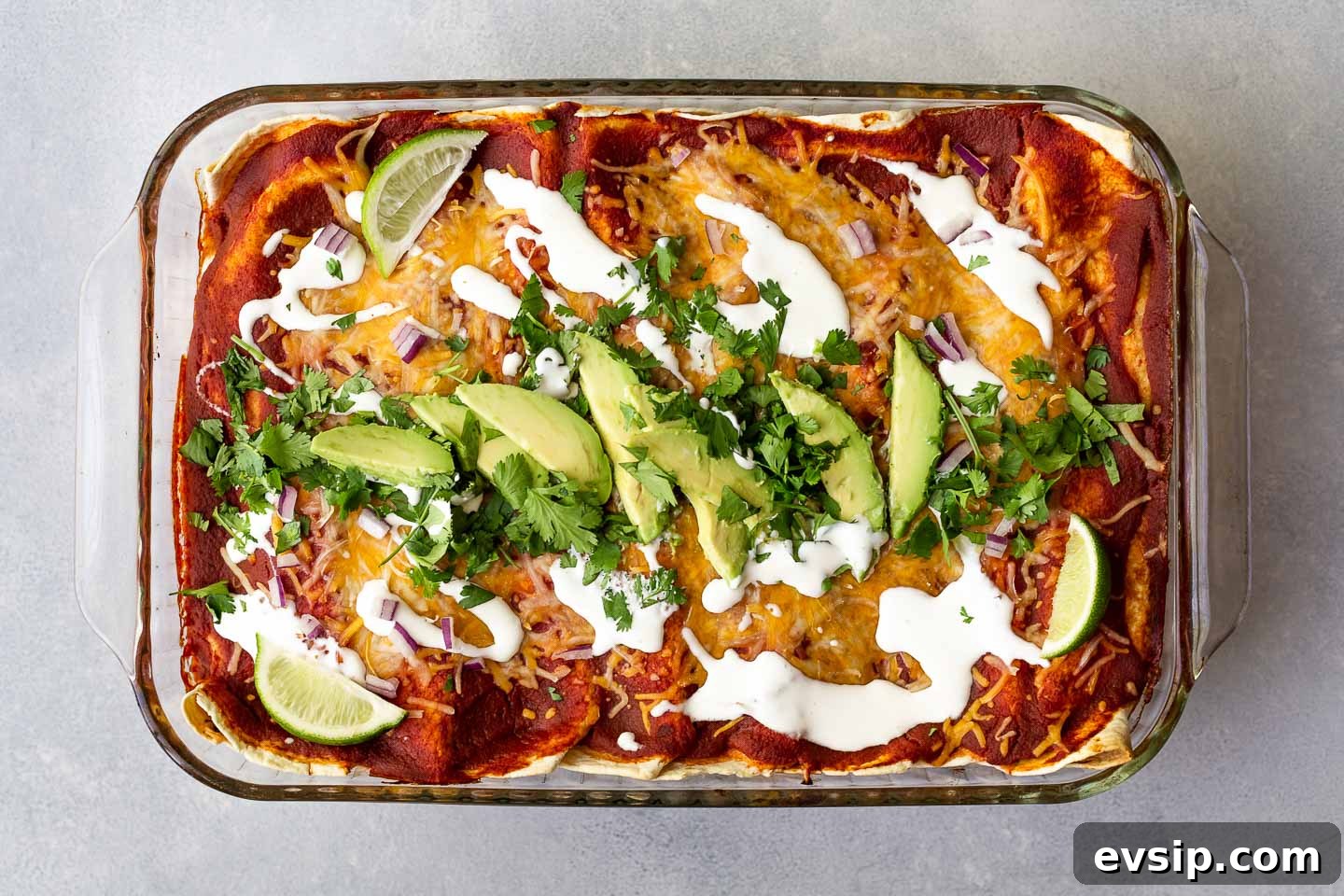 Sweet Potato Enchilada Casserole Recipe 4 A sweet potato enchiladas topped with avocado and cilantro.