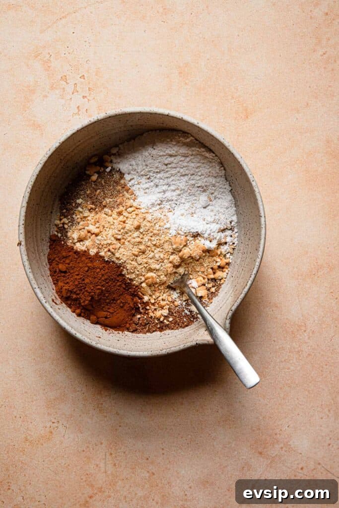 Israeli Chocolate Truffles Recipe — Classic No-Bake Treat 4 A bowl with ingredients to make unbaked chocolate cookies.