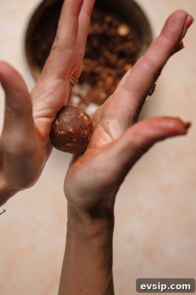 Israeli Chocolate Truffles Recipe — Classic No-Bake Treat 7 Hands rolling cookie.