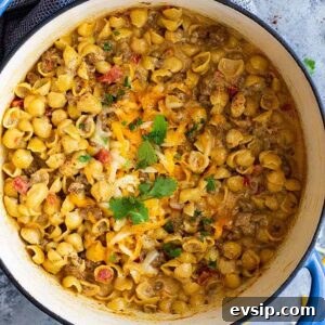 Chile Con Queso Mac and Cheese -is a great one pot meal for any night of the week! It's quick and easy (only takes 30 minutes), cheesy, and will become a family favorite!