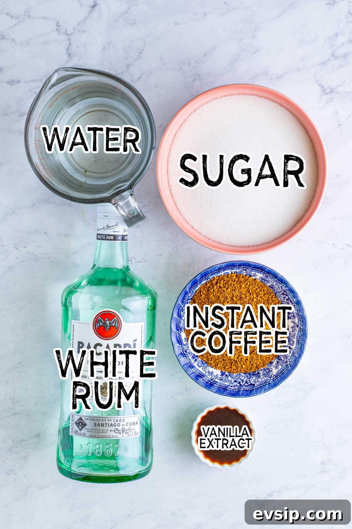 Homemade Kahlúa Liqueur Recipe: How to Make Coffee Vodka Liqueur 3 Ingredients on a white marble counter.