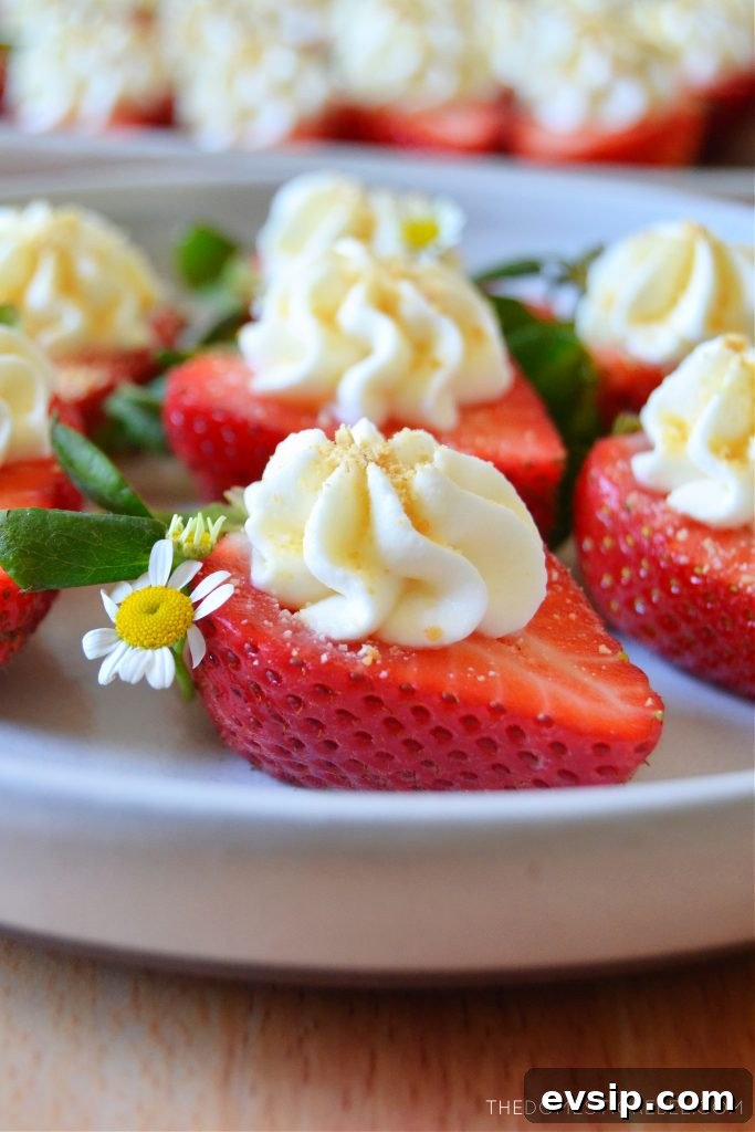 a white plate with cheesecake deviled strawberries on it