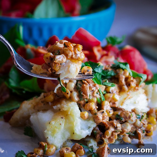Skillet-Seared Cod with Creamy Corn Relish and Lemon Garlic Sauce 4 Taking a bite of skillet cooked cod with creamy corn relish.