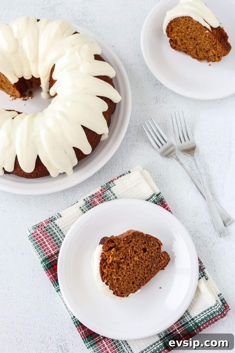 overhead view of a slice of gingerbread bundt cake from a mix, served on a white plate.