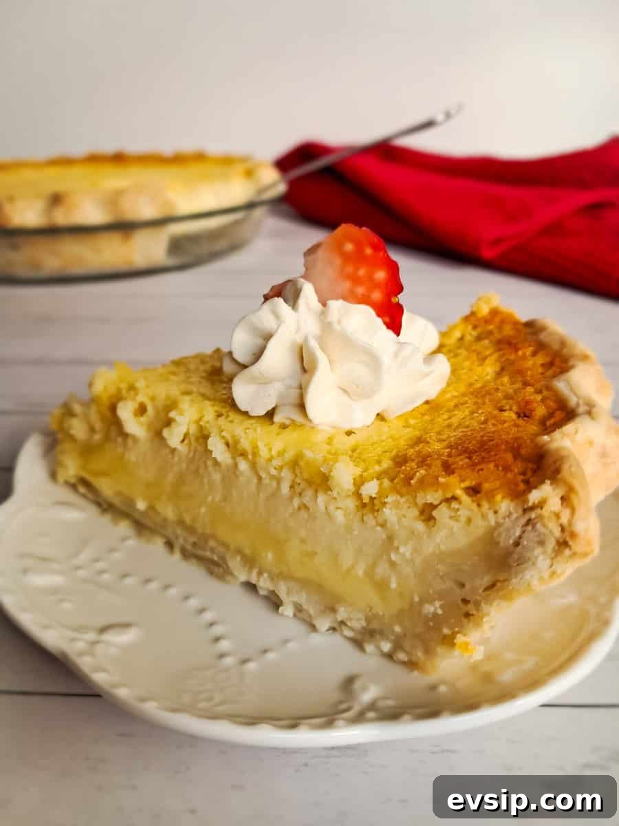 featuring a slice of classic  buttermilk pie topped with whipped cream.