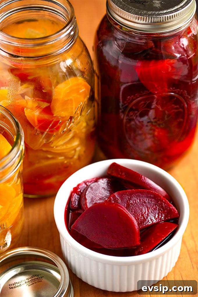 Quick Tangy Pickled Beets Recipe for Homemade Jars 2 Pickled Beets in a small white bowl with canning jars in the back ground on wooden board